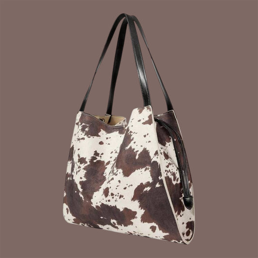 Bolso tote estampado efecto vaca con asas negras
