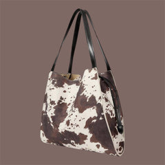Bolso tote estampado efecto vaca con asas negras